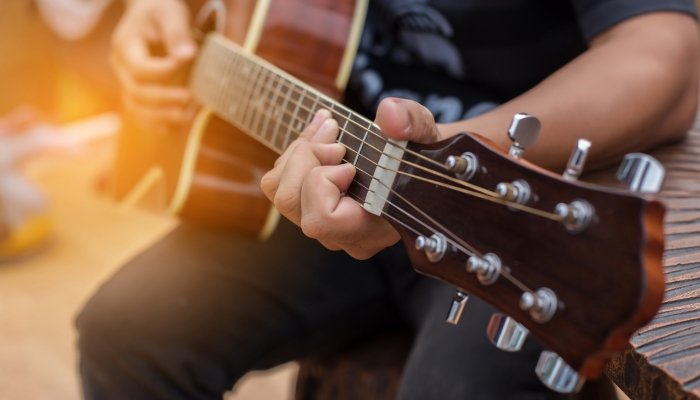 Male playing guitar