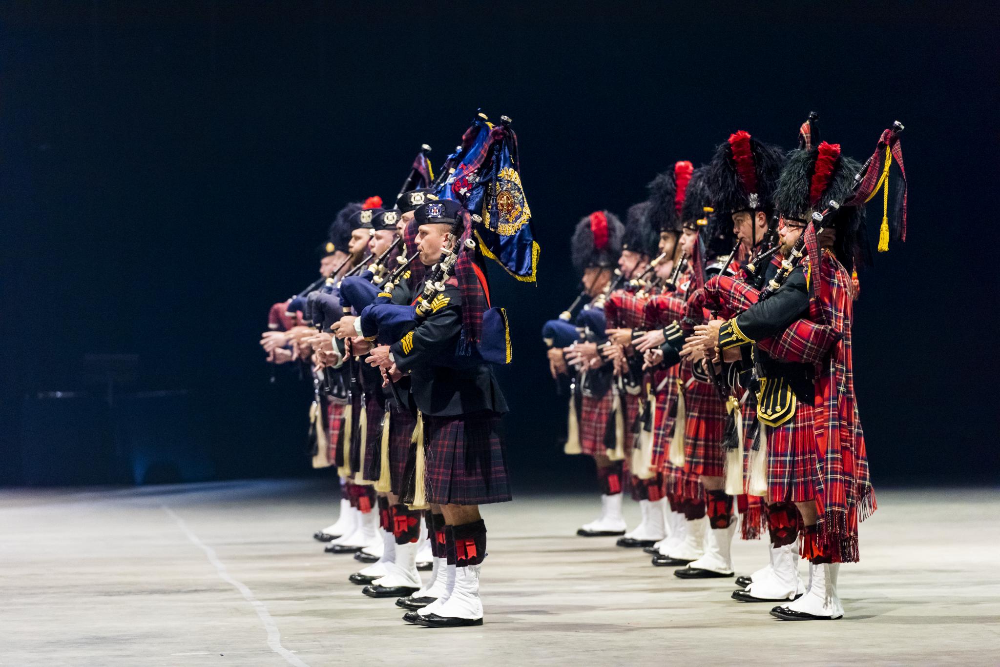 two rows of bagpipers in full regalia