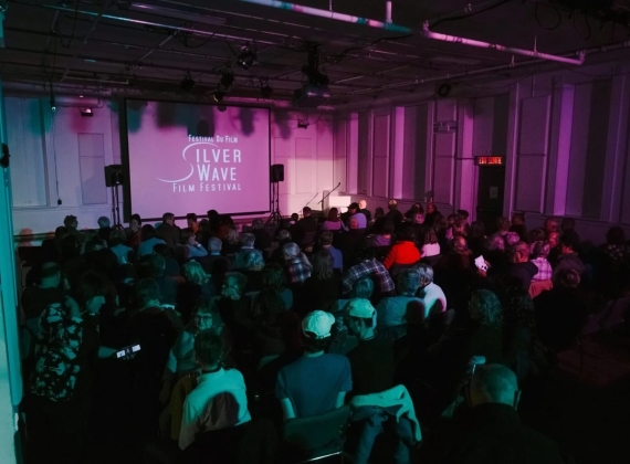 Audience at the Silver Wave Film Festival waiting for the film to begin